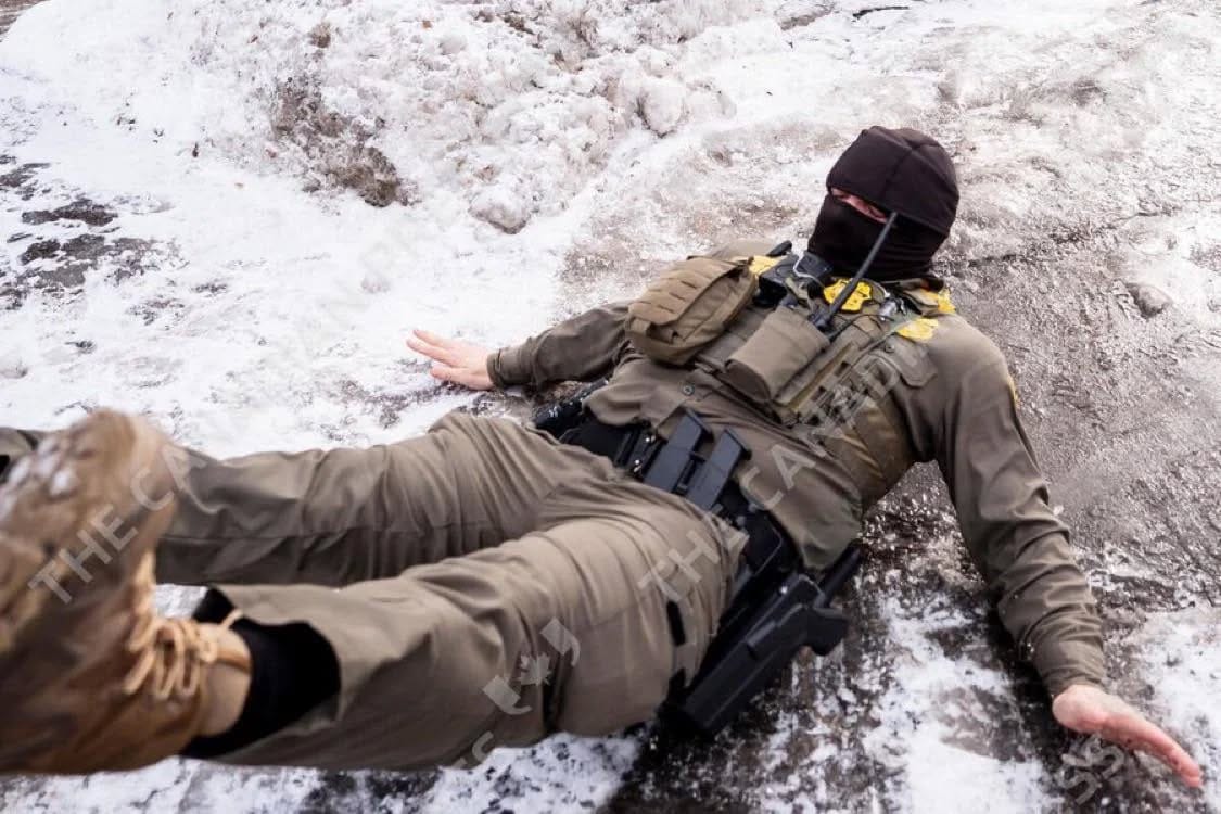 ICE agent slipping on ice.