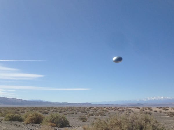 UFO Sighting above dry land on sunny day